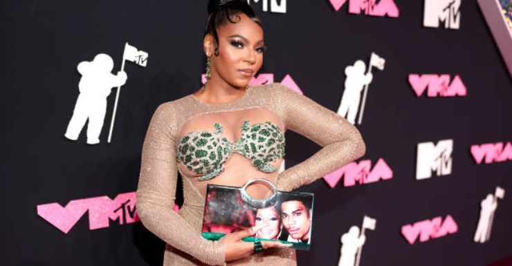 Ashanti's Heartfelt Fashion Statement: A Clutch with Nelly's Face